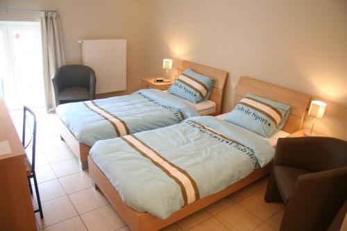 Cama o camas de una habitación en Hoeve Jadoul
