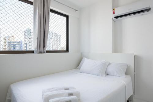 מיטה או מיטות בחדר ב-Conforto e praticidade em Boa Viagem.