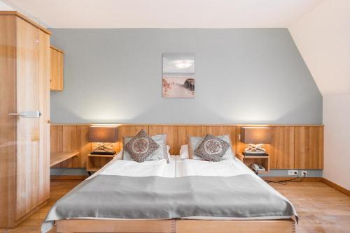 a bedroom with a large bed in a room at Ökotel Hamburg in Hamburg