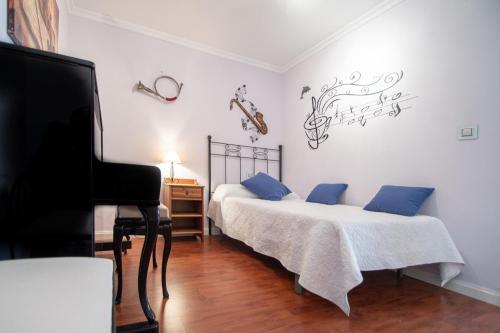 Postel nebo postele na pokoji v ubytování Apartamento El Pentagrama de Cádiz