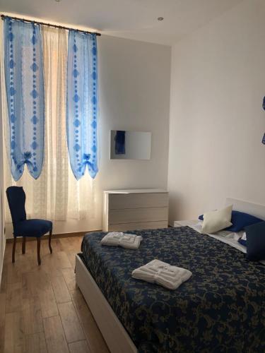 a bedroom with a bed with two towels on it at Dimora Diamante del Lago in Castel Gandolfo