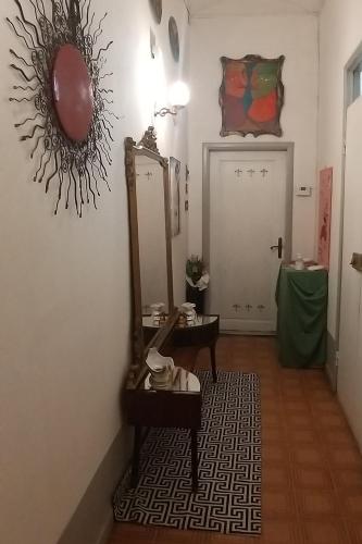 a dressing room with a mirror and a table at Vasari Home in Arezzo
