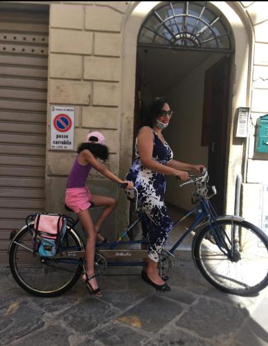 a woman and a little girl on a bike at Vasari Home in Arezzo