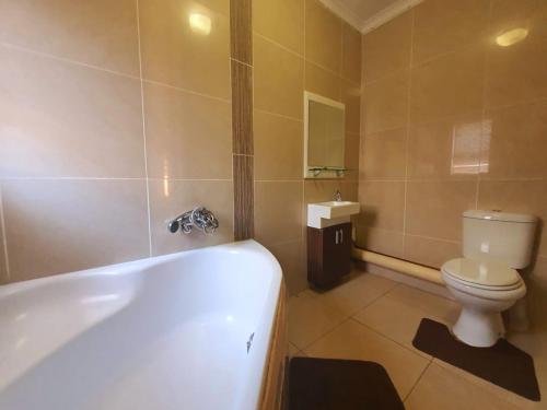 A bathroom at Tenacity Guesthouse - Riviera Park