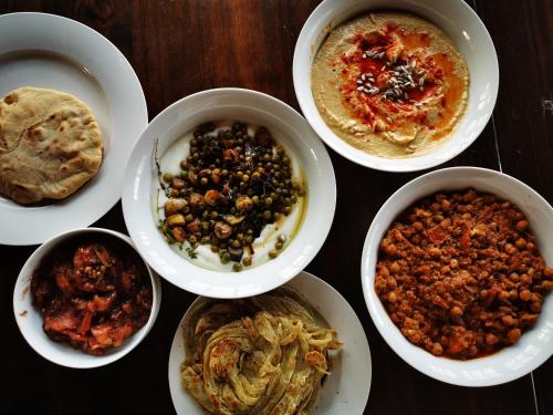 a group of bowls of food on a table at Mbizi Bush Lodge in Grietjie Nature Reserve