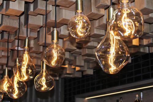 a bunch of lights are hanging from a ceiling at Holiday Inn - Villingen - Schwenningen by IHG in Villingen-Schwenningen