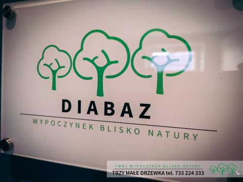 a sign for a drugstore with trees on it at Trzy Małe Drzewka in Wielka Wieś