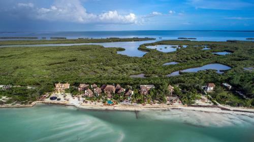 an aerial view of a resort on an island in the water at Hotel Villas Flamingos in Holbox Island