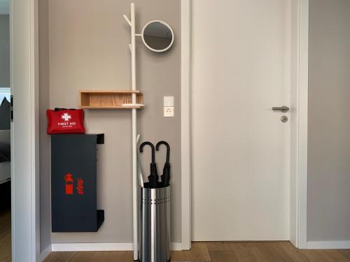 a room with a door with a trash can next to it at Bungalow-Ferienhaus Pottenstein in Pottenstein