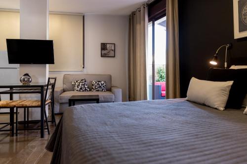 En eller flere senge i et værelse på Casa Los Cuatro Soles