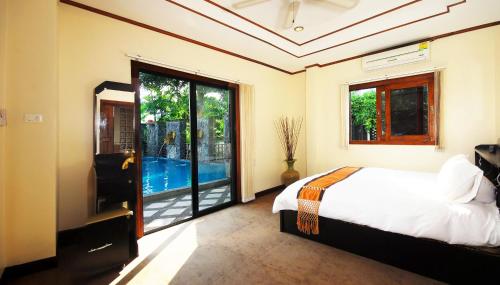 Voodi või voodid majutusasutuse Samui Sun Villa toas