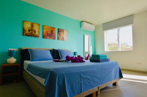 Ένα ή περισσότερα κρεβάτια σε δωμάτιο στο Blue Bay Beach Villas & Apartments
