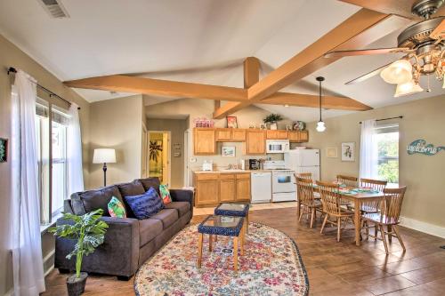 a living room with a couch and a table at Cozy Ironton Cabin with Shared Pool and Private Patio! in Ironton
