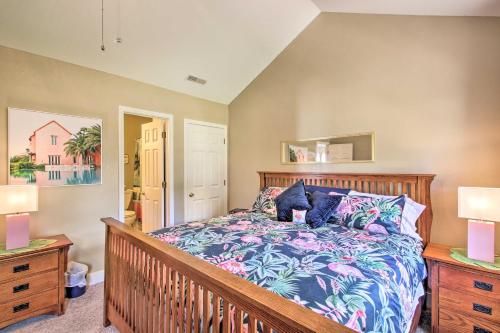 a bedroom with a bed and two night stands at Cozy Ironton Cabin with Shared Pool and Private Patio! in Ironton