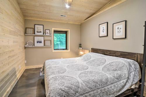 a bedroom with a bed in the corner of a room at Modern Arcadia Farmhouse on 80 Acres - Near Beach! in Arcadia