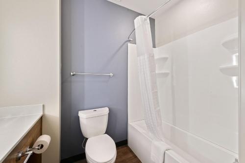 a bathroom with a toilet and a shower at Extended Stay America Premier Suites - Savannah - Pooler in Savannah