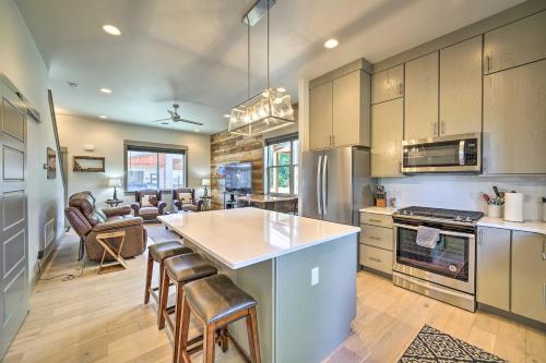 a kitchen with a large island in the middle at Bozeman Stand-Alone Home with River Access! in Bozeman