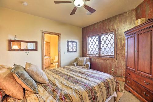a bedroom with a bed and a ceiling fan at Charming Cedar City Retreat - Walk to SUU Campus! in Cedar City