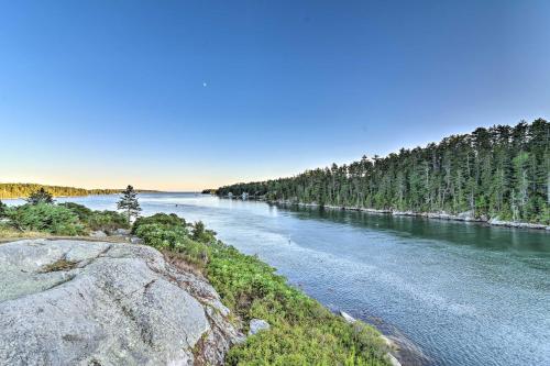 a view of a river with trees in the background at Oceanfront Cottage with Deck 2 Mi to Boothbay Harbor in West Boothbay Harbor