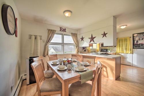 a kitchen and dining room with a table and chairs at Albany Home with Fenced Yard and Patio - Pets Welcome! in Albany