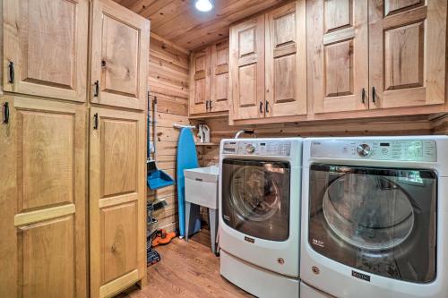 a kitchen with a washer and dryer in a cabin at Hayesville Cabin with Game Room and Mtn Views! in Hayesville