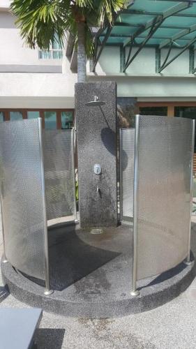 two metal stalls in front of a building at 9am-5pm, SAME DAY CHECK IN AND CHECK OUT, Work From Home, Shaftsbury-Cyberjaya, Comfy Home by Flexihome-MY in Cyberjaya