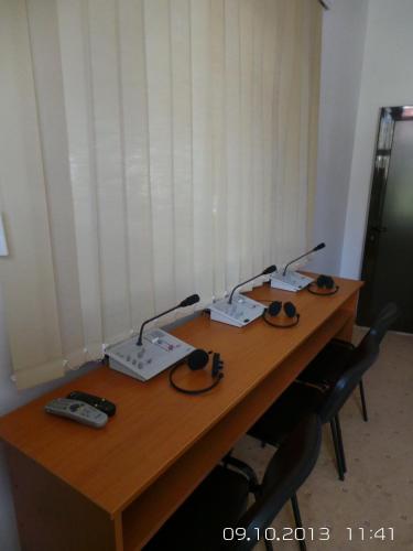 a wooden table with three lights on top of it at Hotel Express in Predeal