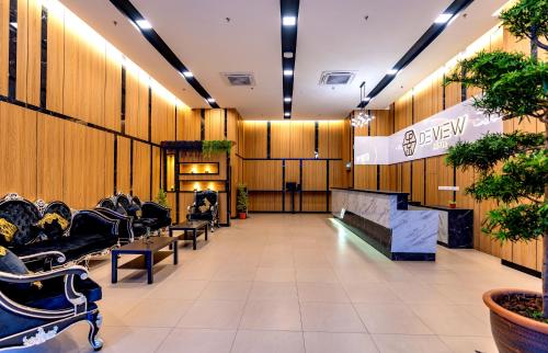 a salon with a waiting room with chairs and plants at Kingston Hotel 13 - Penang Hills formerly known as Deview Hotel in Ayer Itam
