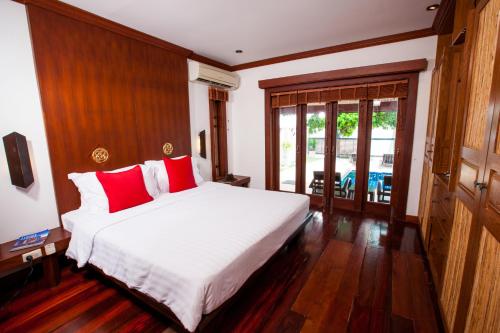 
Ein Bett oder Betten in einem Zimmer der Unterkunft Pao Jin Poon Villa
