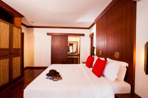 Ein Bett oder Betten in einem Zimmer der Unterkunft Pao Jin Poon Villa