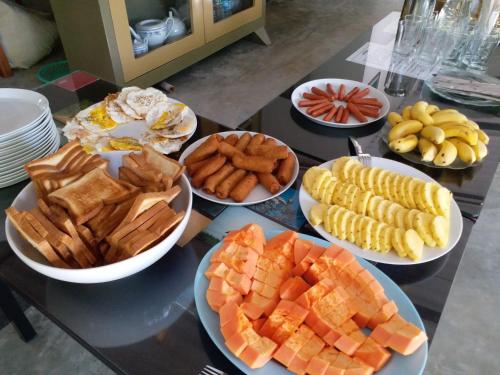 a table topped with plates of different types of food at The Boundary Yala in Kataragama