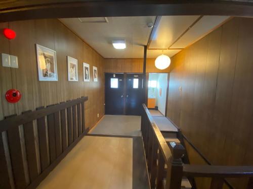 a hallway with a bench and a door at Shiga Biwa Lake Shanshui House in Takashima