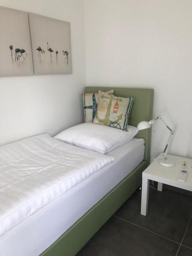 Ένα ή περισσότερα κρεβάτια σε δωμάτιο στο Ferienhaus SEE & Ferienhaus SEEBLICK