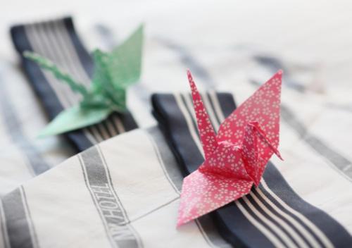 a red paper crane sitting on top of a fork at APA Hotel Marugame Ekimae Odori in Marugame