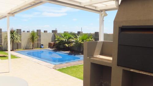 a swimming pool on the roof of a building at B.R.O.Homes and Villas in Port Elizabeth