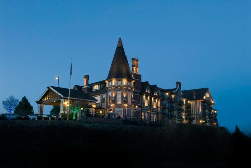 a large house lit up at night with lights at Holiday Inn Express Spokane-Downtown by IHG in Spokane