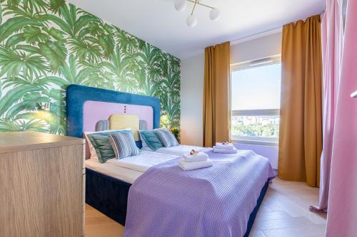 En eller flere senge i et værelse på Apartamenty Your Seaside