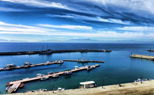 a marina with a bunch of boats in the water at Hotel Epavli in Nea Kalikratia