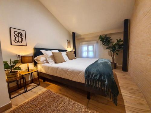 a bedroom with a large bed in a room at MH Apartments Central Sevilla in Seville