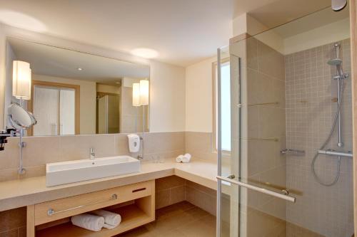 a bathroom with a sink and a shower at Atlantica Plimmiri in Plimmiri