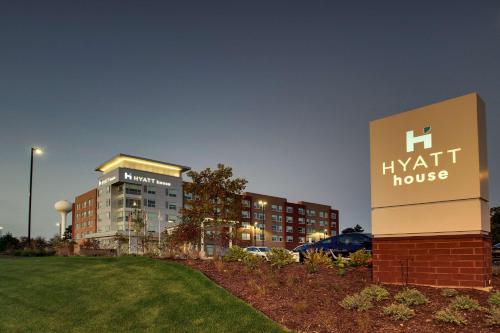 a h kent house sign in front of a building at Hyatt House Oak Brook in Oak Brook