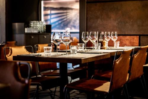 a table with wine glasses on it in a restaurant at Tallink Silja Line Ferry - Helsinki to Stockholm in Helsinki