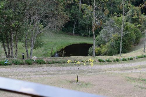 a small tunnel in the middle of a field at Chalés Boa Vista in Gonçalves