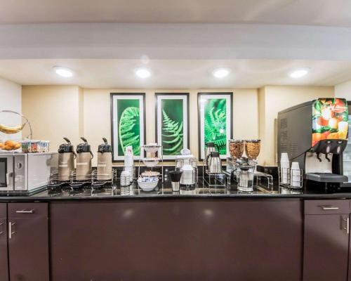 a kitchen with a counter top with a coffee maker at Sleep Inn & Suites Guthrie - Edmond North in Guthrie