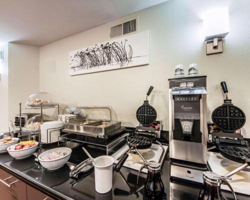 a kitchen with a counter with some food on it at Sleep Inn & Suites Guthrie - Edmond North in Guthrie