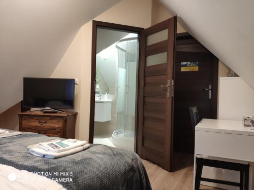 Una cama o camas en una habitación de Pod Skrzydłami Podlasia