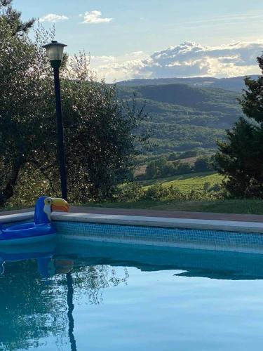 a swimming pool with a water slide next to a light pole at Gorgeous 2-storey villa with a large private pool in Todi