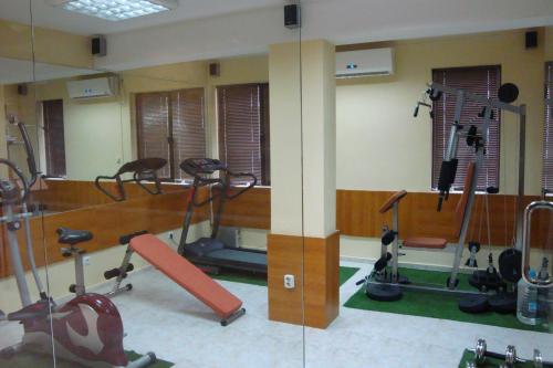 a gym with several treadmills and exercise bikes at FAMILY HOTEL SAINT PETER in St. St. Constantine and Helena