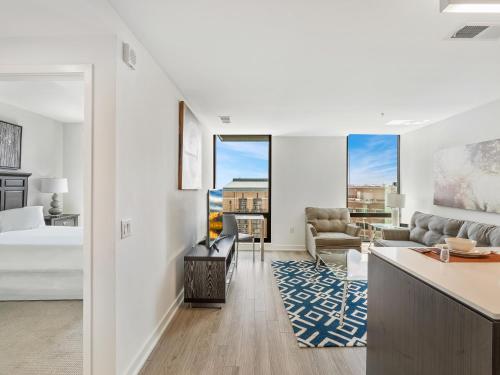 a bedroom with a bed and a living room at Global Luxury Suites at Reston Town Center in Reston