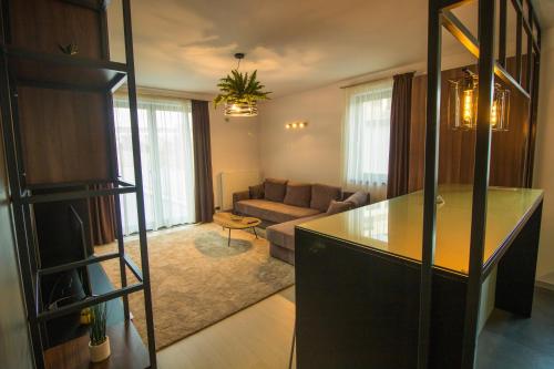 a living room with a couch and a table at Gente Apartments in Cluj-Napoca